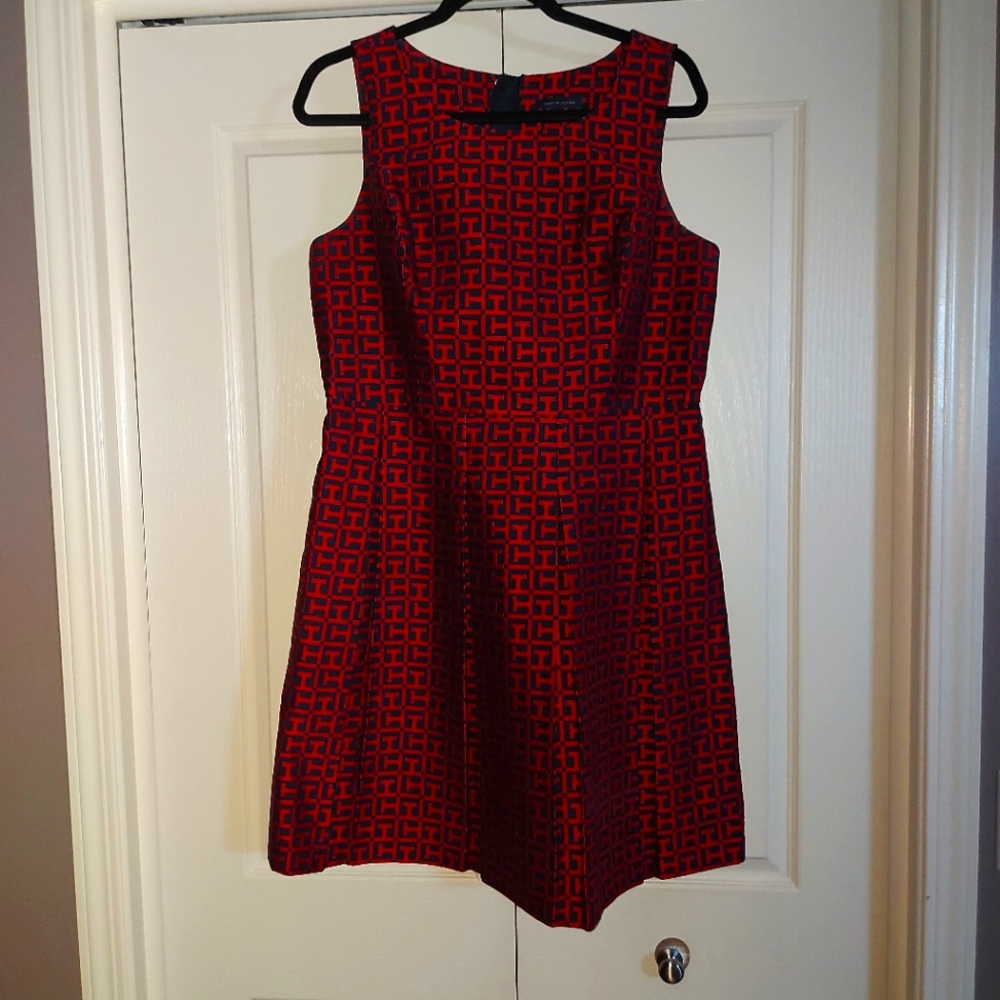 Red with dark navy pattern dress. Bold gold back zipper. Worn once